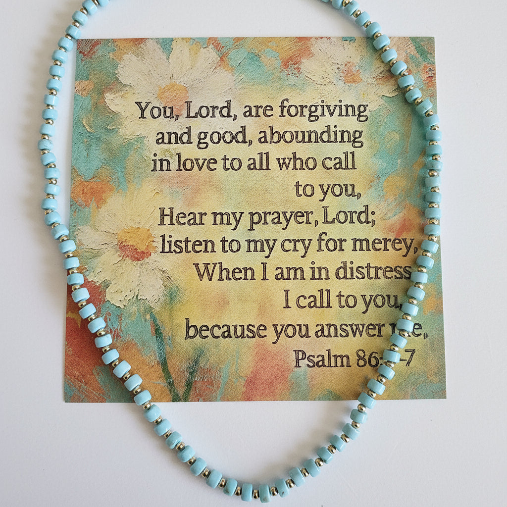 Turquoise beaded bracelet with a card featuring text on a light background