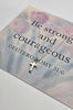 Silver cross necklace on a card with Br strong and courageous 