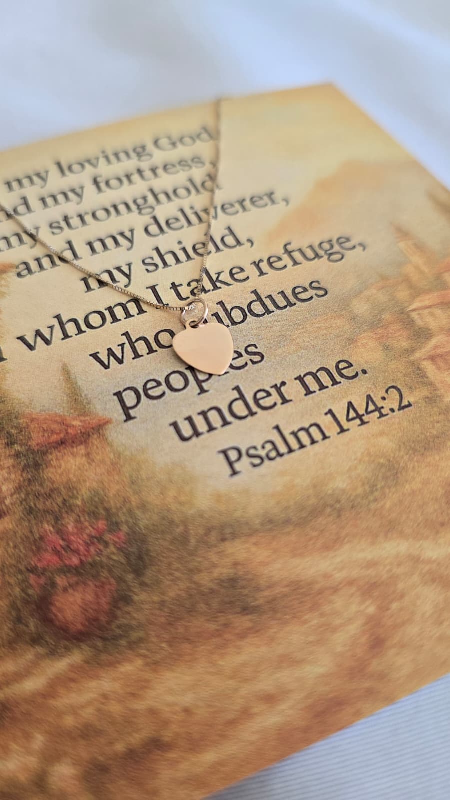 24k Gold heart necklace on scripture card 