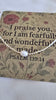 Necklace with a pearl pendant on a card with scripture and floral design