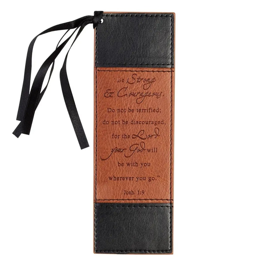 Leather bookmark with black ribbon and engraved text on a white be background,be strong and courageous