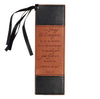Leather bookmark with black ribbon and engraved text on a white be background,be strong and courageous