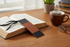 Leather bookmark with black ribbon and engraved text 