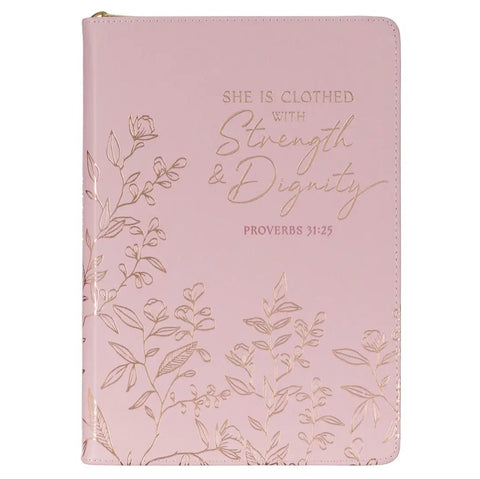 Pink notebook with floral design and 'She is Clothed with Strength & Dignity' text on a white background