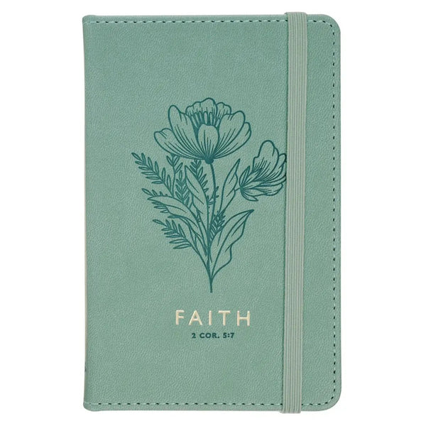 Green notebook with floral design and 'FAITH' text on a white background