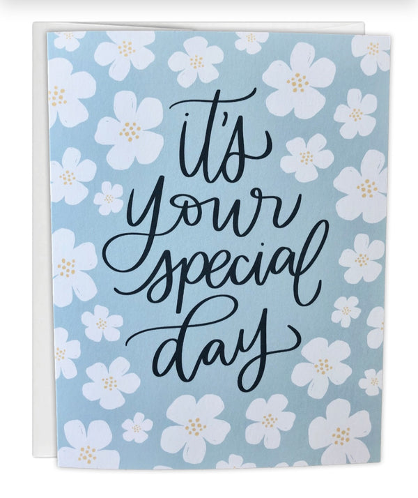 Greeting card with floral design and 'it's your special day' text on a light blue background