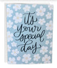 Greeting card with floral design and 'it's your special day' text on a light blue background