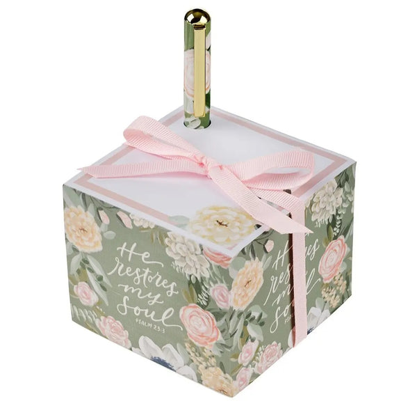 Floral-themed notepad with a pink ribbon on a white background. He restores my soul.